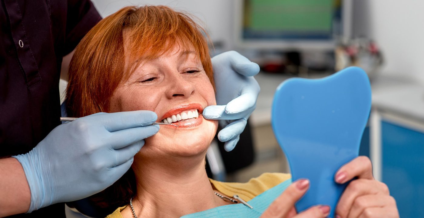 Woman being fit for dentures