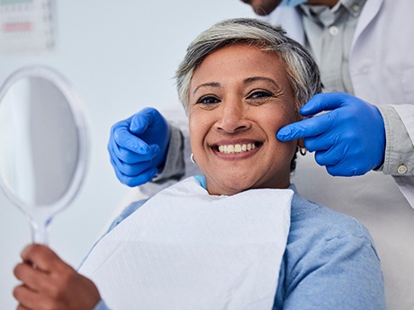 Middle-aged woman smiling after receiving nitrous oxide