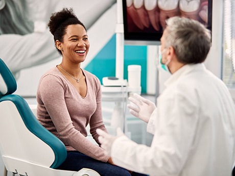 patient speaking with their dentist