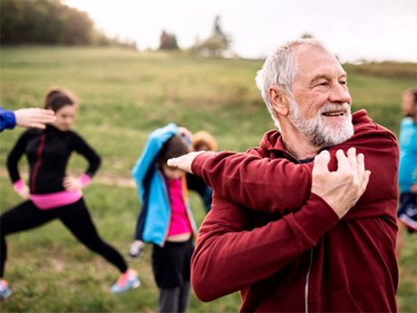 an older man enjoying an outdoor workout 