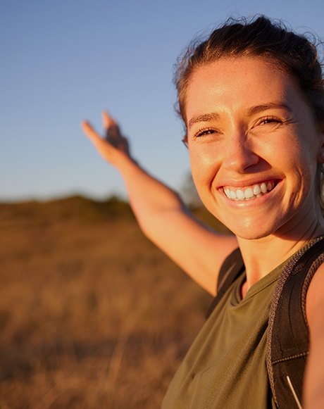 Smiling woman taking selfie on hike